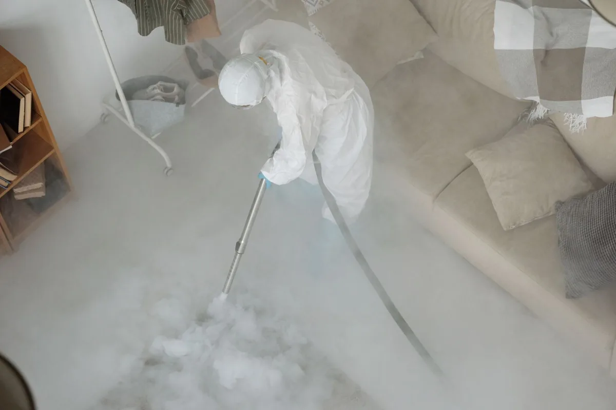 Biohazard cleanup technician in protective equipment, Crossroads, Kansas City, MO